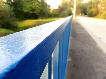 Close-up of road against blue sky