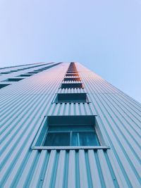 Low angle view of tall building against clear sky