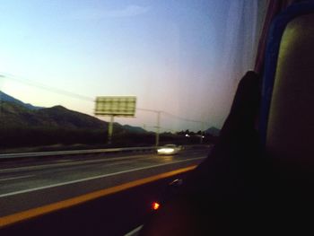 Road seen through car windshield