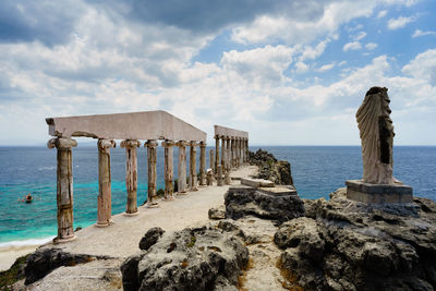 Pier over sea against sky