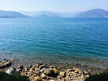 Scenic view of sea against blue sky