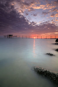 Scenic view of sea against sky at sunset