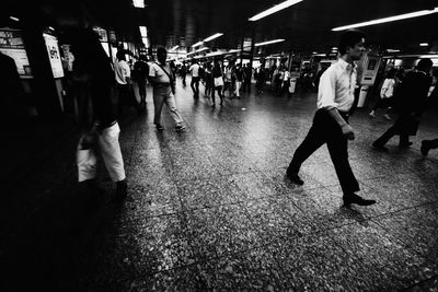 Commuters walking in subway station