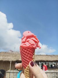 Close-up of hand holding ice cream