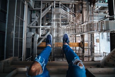 Low section of man standing at construction site