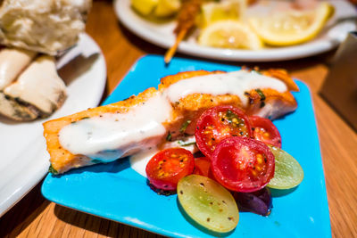 Close-up of food served in plates on table