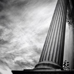 Low angle view of built structure against cloudy sky
