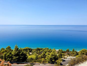 Scenic view of sea against blue sky