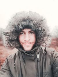 Portrait of young man wearing warm clothing during winter