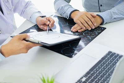 Low angle view of man working on table