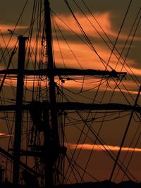 Silhouette of ship against sky during sunset