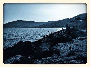 View of sea with mountains in background