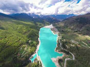 Barcis lake from above in a aerial panoramic view during sunny and cloudy sky