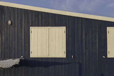 Wooden fence against sky