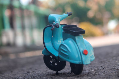 Blue toy car on street