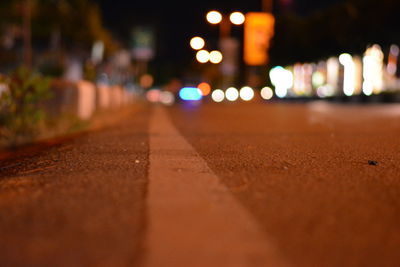 Surface level of illuminated street at night