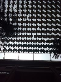 Low angle view of roof and building against sky