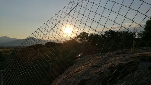 Close-up of chainlink fence at sea