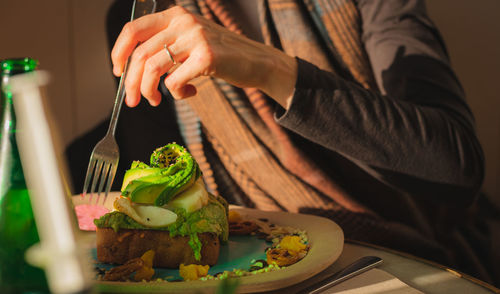 Midsection of man preparing food on table