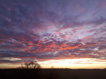 Low angle view of dramatic sky during sunset