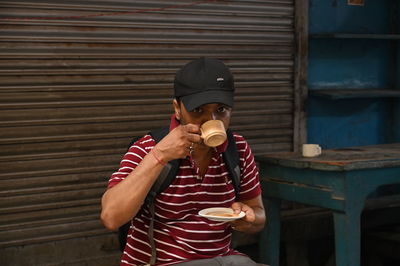 A man sipping hot tea at kolkata street