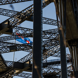 Low angle view of bridge against blue sky