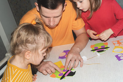 High angle view of boy playing with toys at home