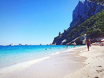 Scenic view of beach against clear sky