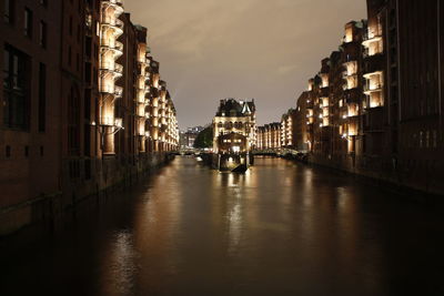 Illuminated buildings in city at night