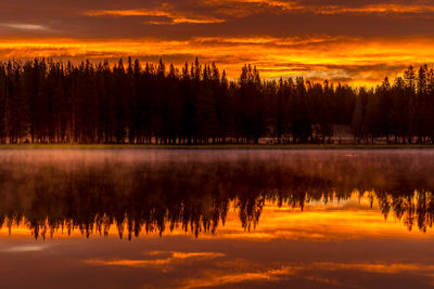 Scenic view of lake against romantic sky at sunset