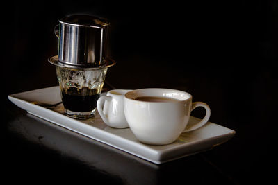 Close-up of coffee cup on table