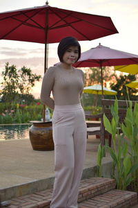 Portrait of young woman standing outdoors