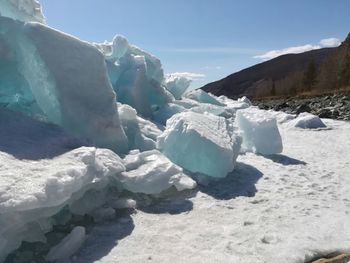 Scenic view of frozen lake against sky