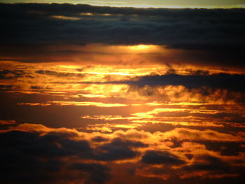 Scenic view of dramatic sky at sunset