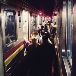 People in train at night