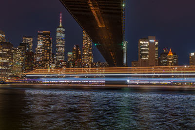 Illuminated city at waterfront