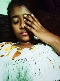 Portrait of a woman lying down on bed