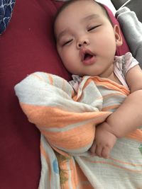 Cute baby girl sleeping in bed
