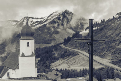 Panoramic view of building and mountains against sky