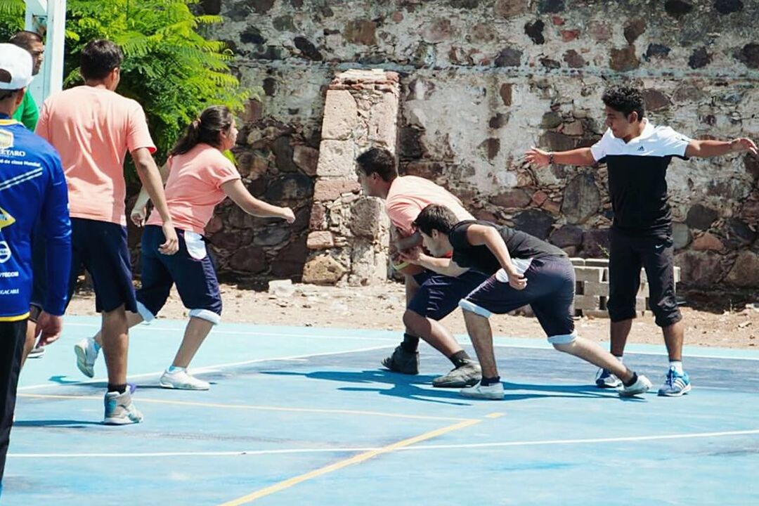 lifestyles, men, leisure activity, full length, walking, casual clothing, person, togetherness, street, large group of people, day, boys, sunlight, high angle view, road, sport, outdoors, rear view