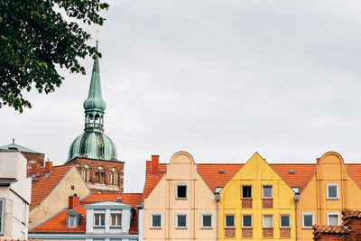 View of buildings in city against sky