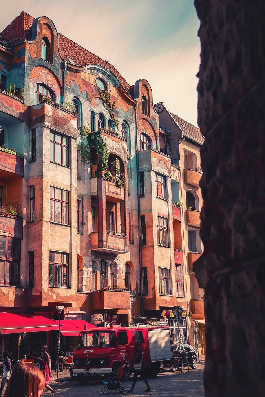 CARS PARKED ON STREET AGAINST BUILDINGS