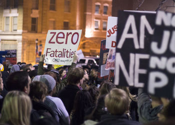 People protesting against police brutality on street during night