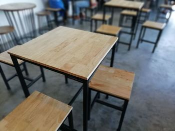 High angle view of empty chairs and table in restaurant