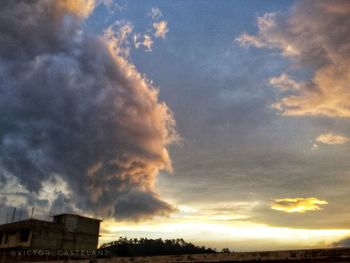 Low angle view of buildings against sky during sunset