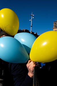 Midsection of woman with balloons
