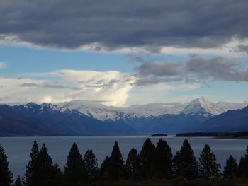 Scenic view of mountains against cloudy sky