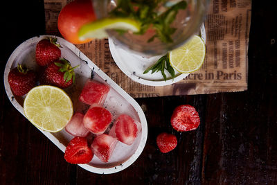 Summer infused water with lemon, lime, mint and strawberry ice. refreshing, diet. hard seltzer 