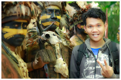 Portrait of smiling boy with birds