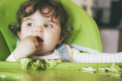 Portrait of cute boy eating food